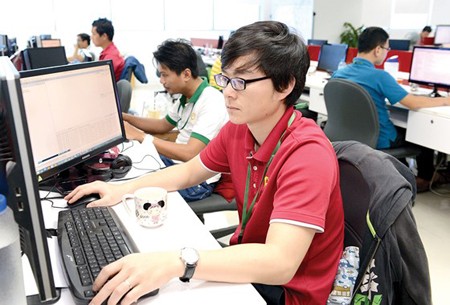 Software programmers work in Quang Trung Software City. Photo by Viet Dung