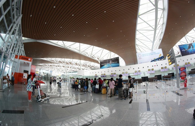Passengers check-in at Da Nang International Airport’s new terminal yesterday. (Photo: VNS)