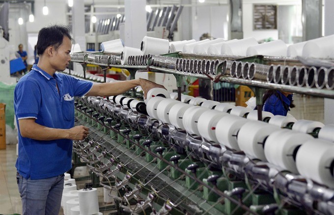 Thread production assembly at the Trung Dung Ltd Co in the capital city’s Thanh Tri District. (Photo: VNA/VNS)