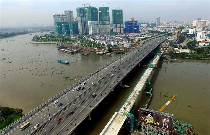 Construction of Urban Railway Metro Line 1 crosses Saigon River in HCM City. The city - the ‘economic locomotive’ of the country, is facing numerous challenges including increasing population, insufficient infrastructure development and environmental poll
