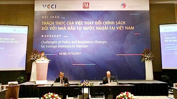 A view of the workshop on challenges of policy and regulatory changes for foreign investors in Vietnam in Hanoi on December 7 (Photo: SGGP)