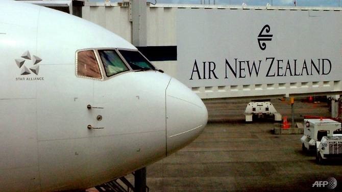 An Air New Zealand Boeing 737 sits at a departure gate at Auckland Airport, Auckland. —AFP/VNA Photo