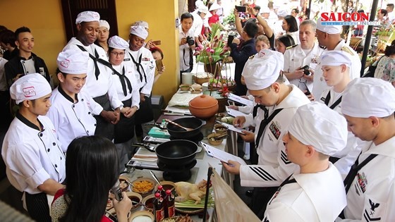 Chefs from the USS Carl Vinson are introduced to Vietnamese traditional dishes by local counterparts.