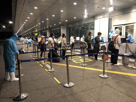 Passengers get health checks at Van Don International Airport.