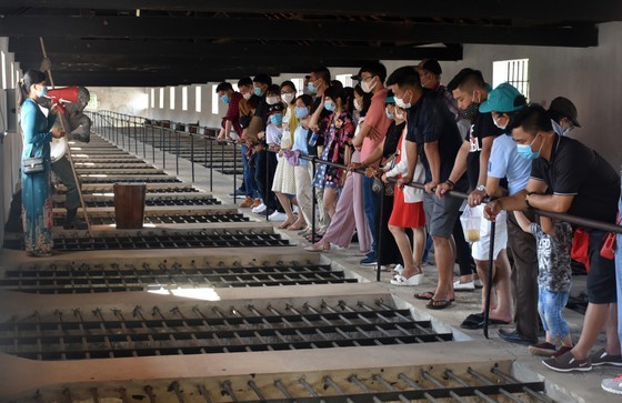 Tourists visit a complex of prisons in Con Dao island.