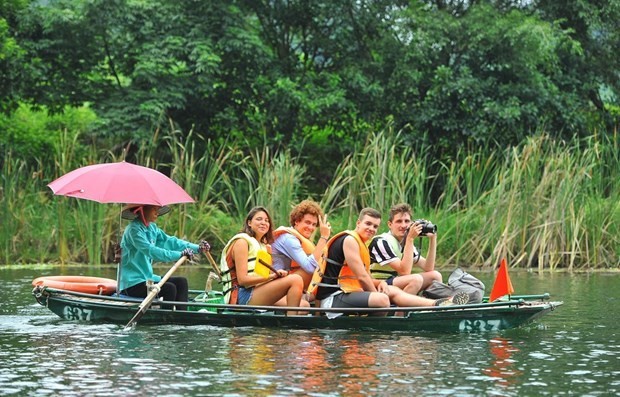 Foreign tourists visit Trang An tourism complex in northern Ninh Binh province (Photo: VNA)